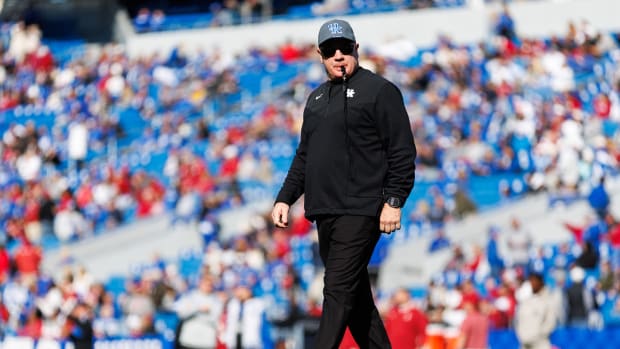 Kentucky Wildcats head coach Mark Stoops walks across the field before the game against the Alabama Crimson Tide at Kroger Field.